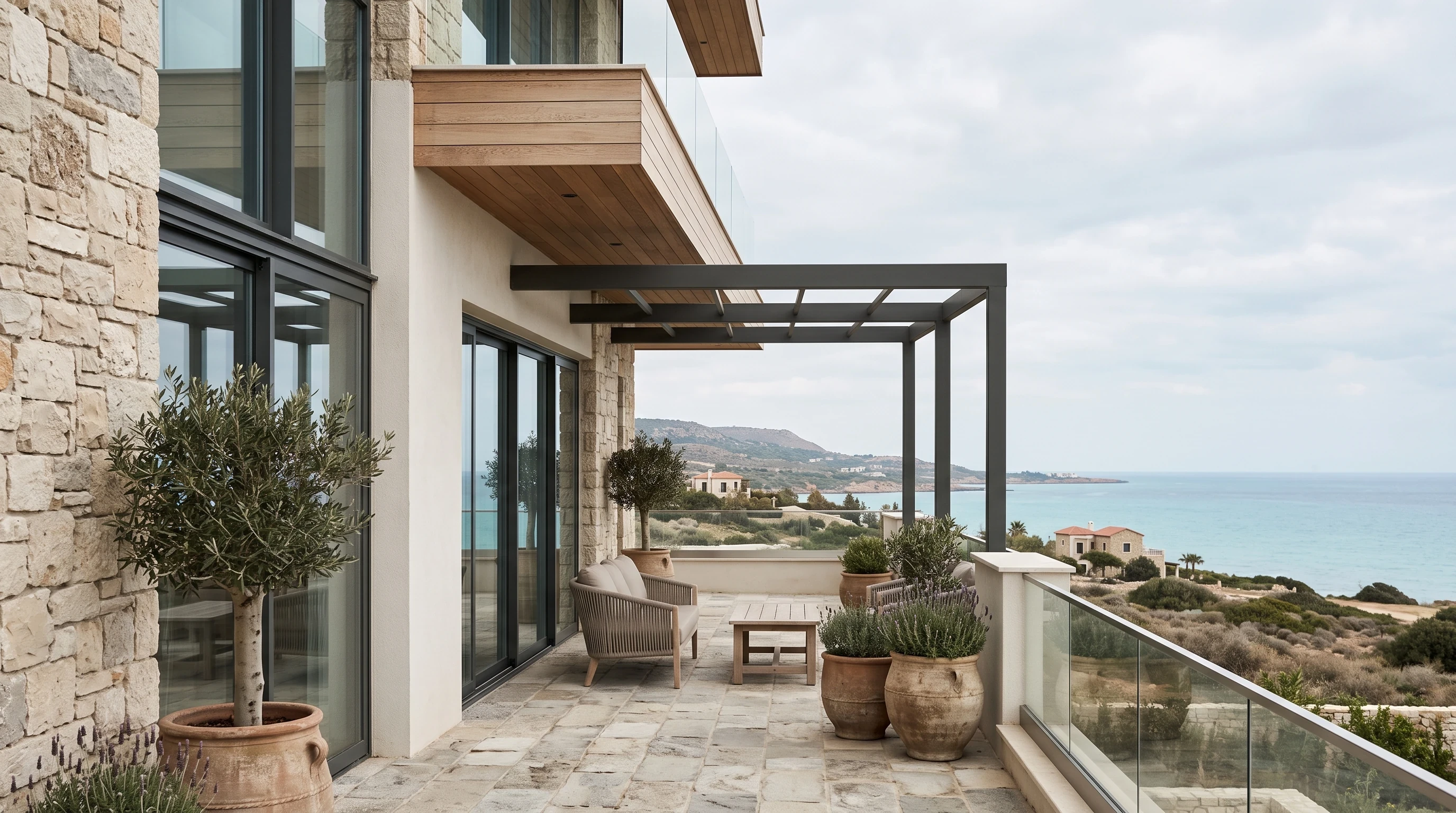 Stone terrace overlooking the coast from a residential property