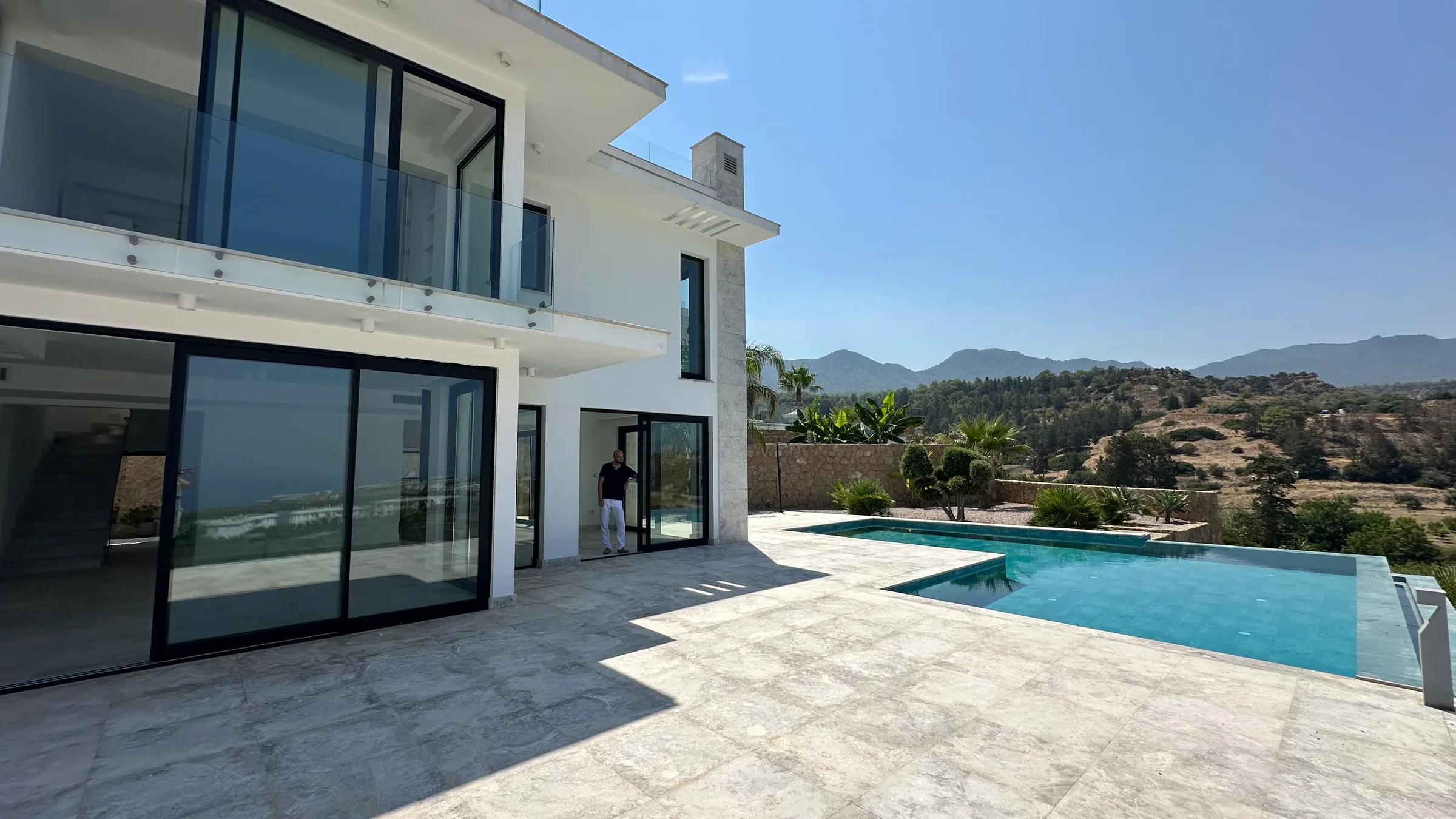 Hillside Villa and its infinity pool against the Esentepe mountains