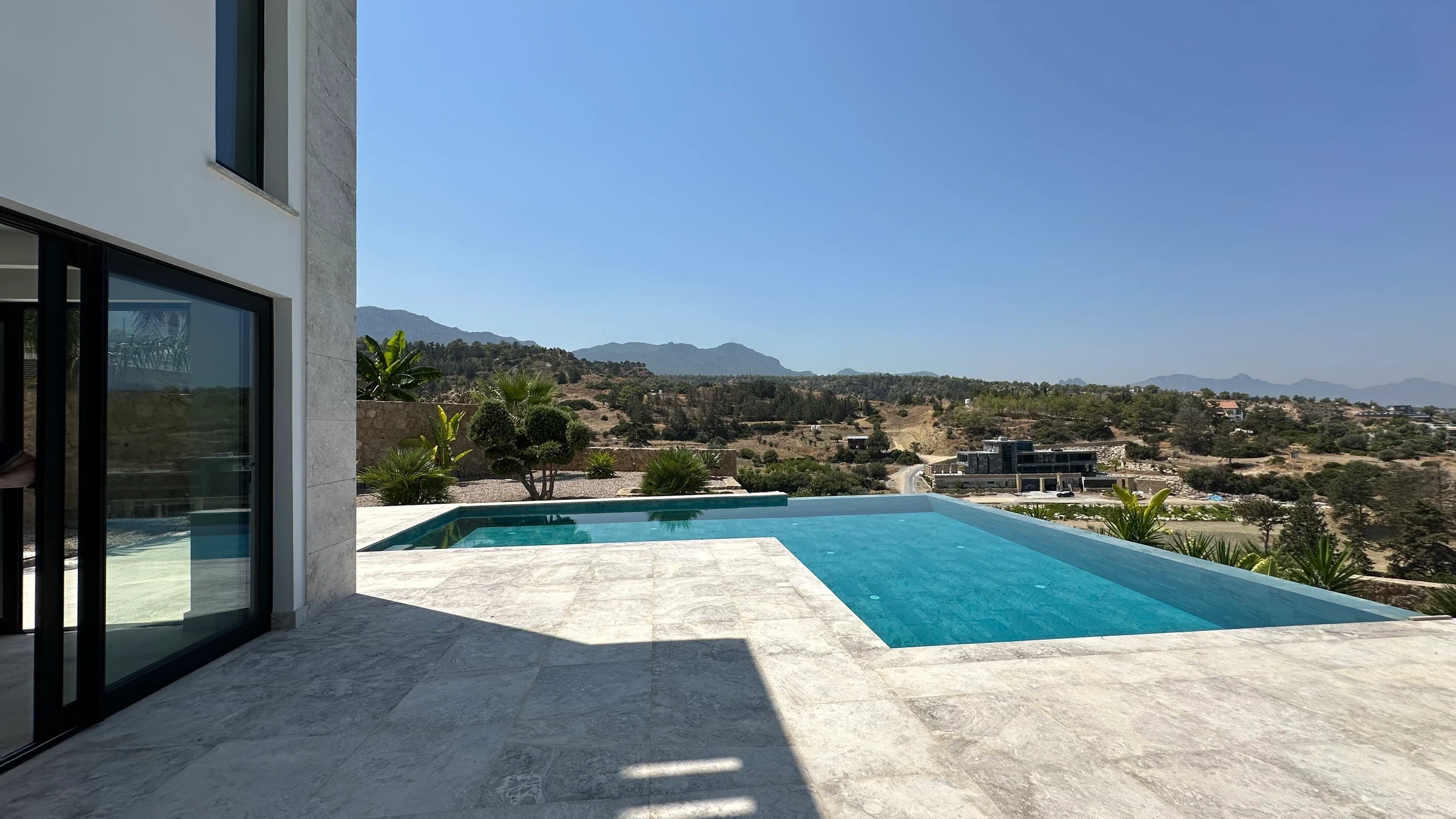 Pool terrace at an Esentepe villa overlooking the hills