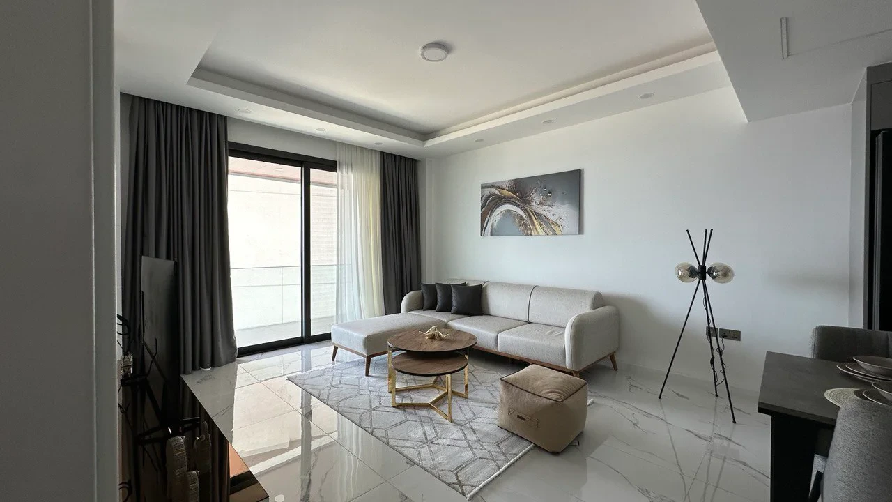 Furnished living room beside a balcony window