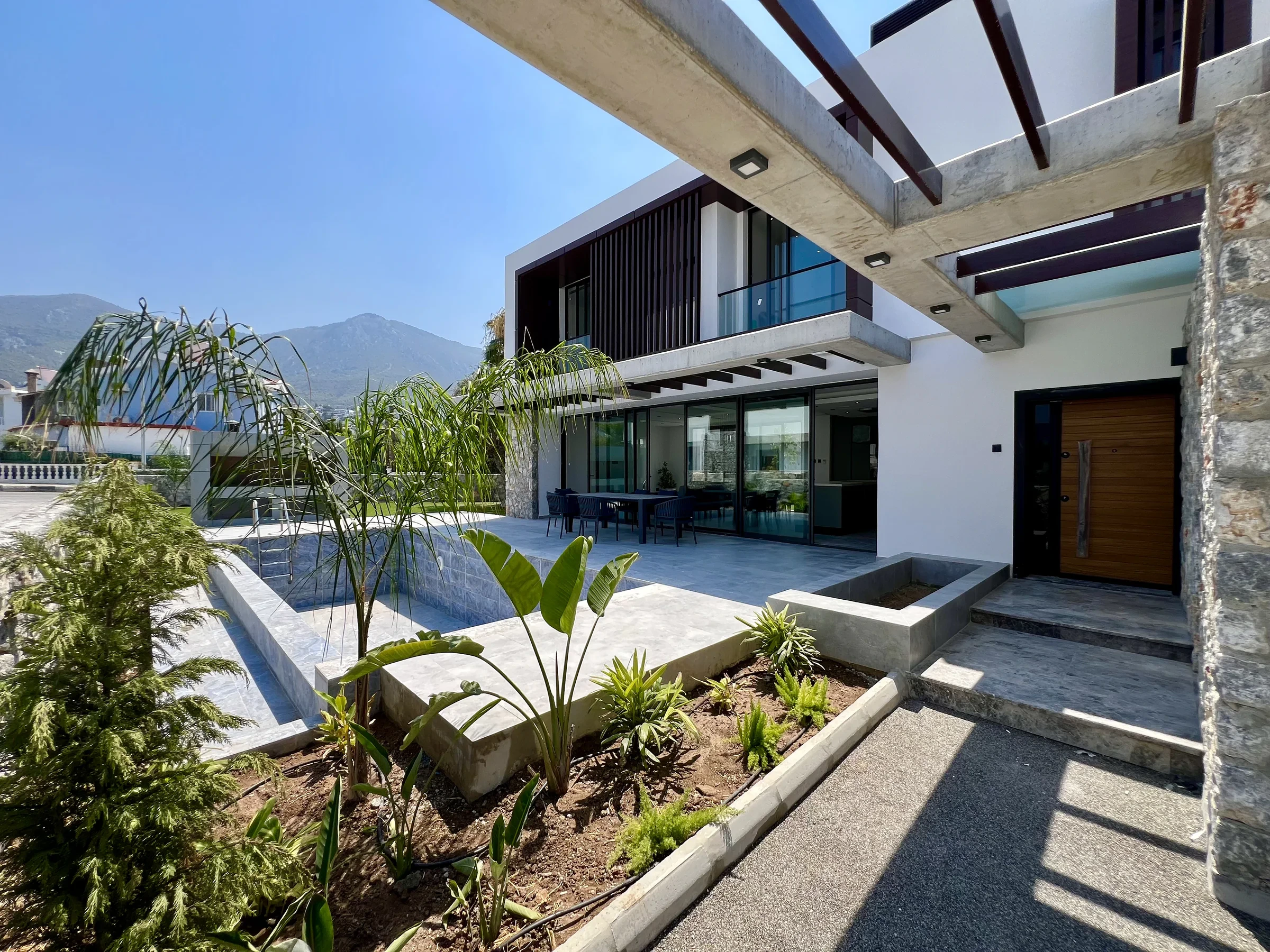 Olive Grove Villa exterior beside its private pool and garden